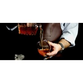 Man pouring brandy