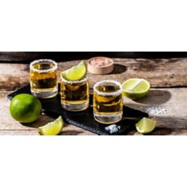 Tequila shot glasses with limes
