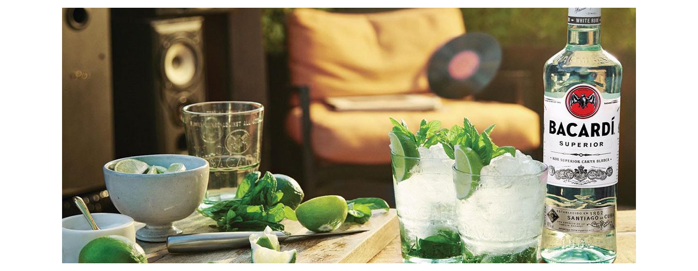 Bottle of Bacardi with two glasses