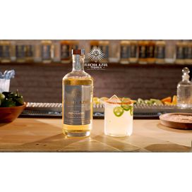 bottle of tequila with cocktail