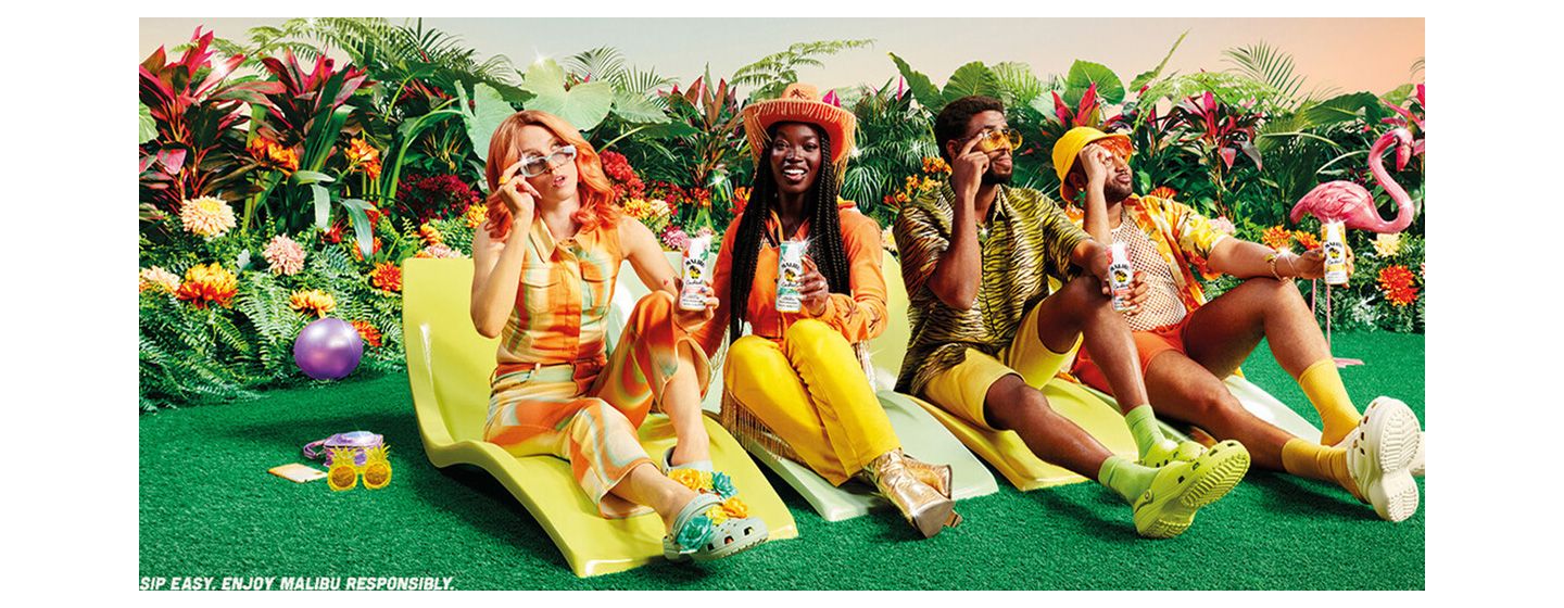 Coconut and pineapple glasses of Malibu with two women