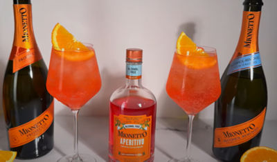 bottles of wine with cocktail and oranges