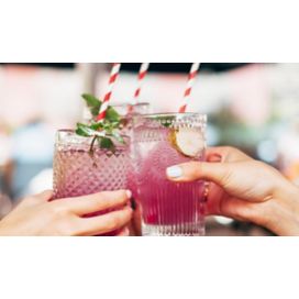 Glass of cocktail with CBD drops