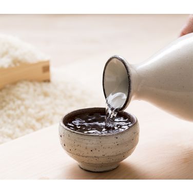 Sake being poured into a bowl