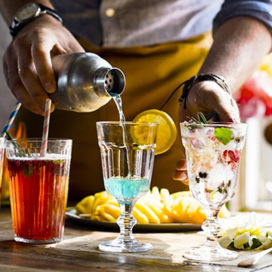 A man making a cocktail