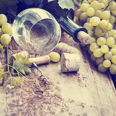 Grapes, bottle and glass of wine with grapes. 