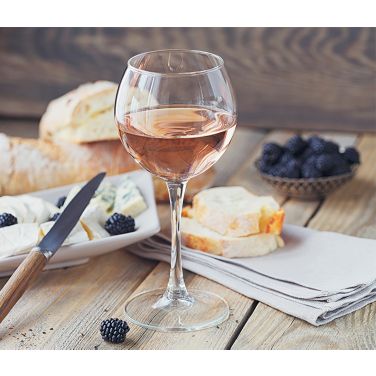 Glass of rose with desser on a table