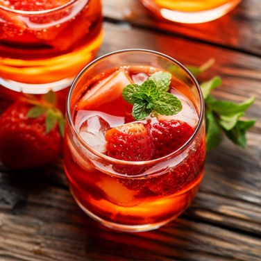 Three glasses of cocktails with strawberries 
