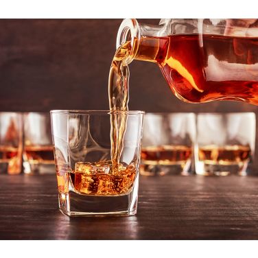 Whiskey being  poured into a glass